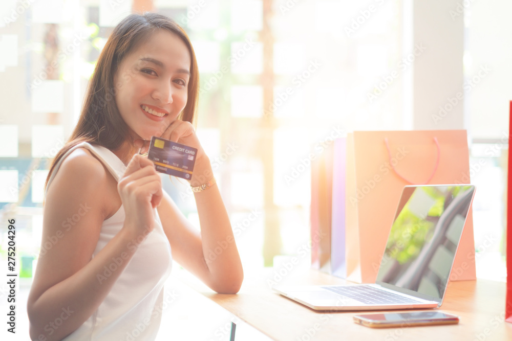 beautiful woman holding credit card enjoying in shopping looking at camera with shopping bags, shopping concept beautiful woman holding credit card enjoying in shopping looking at camera with shopping bags, shopping concept