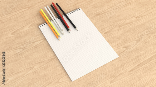 Notebook with colorful pencils