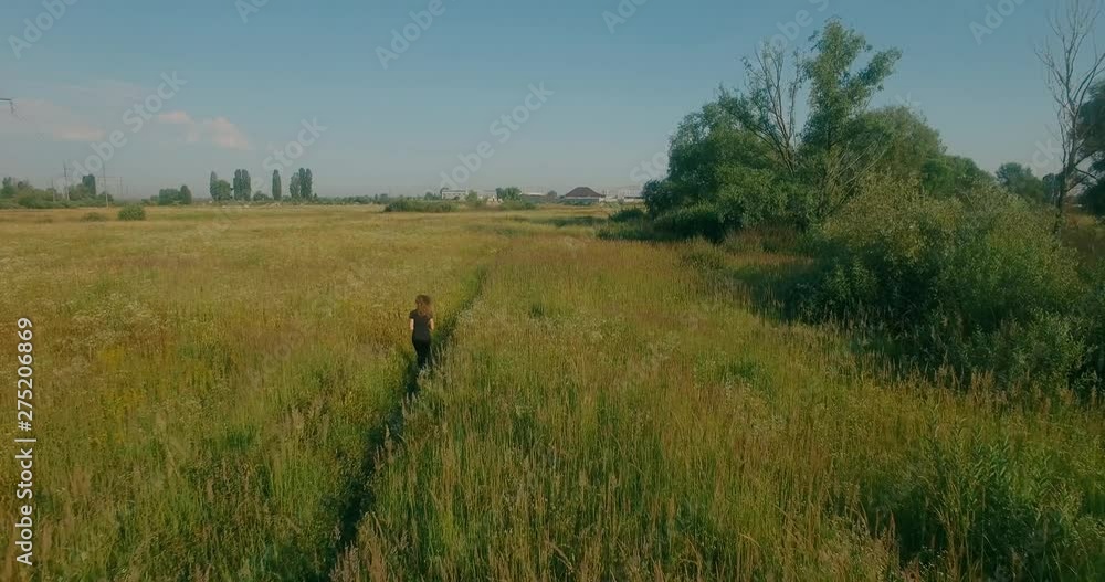 Young Woman Running From Above.Woman Running Aerial In Green Field.Aerial Running Girl On Trail.Sportive Woman Running Aerial From Drone.Runner Aerial On Trail Road.Blonde Girl Jogging At Sunset. Young Woman Running From Above.Woman Running Aerial In Green Field.Aerial Running Girl On Trail.Sportive Woman Running Aerial From Drone.Runner Aerial On Trail Road.Blonde Girl Jogging At Sunset.
