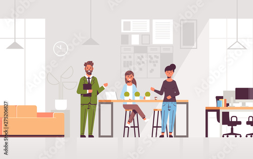 couple coworkers pointing at new female employee introducing hired worker to the team concept modern co-working center office interior flat full length horizontal