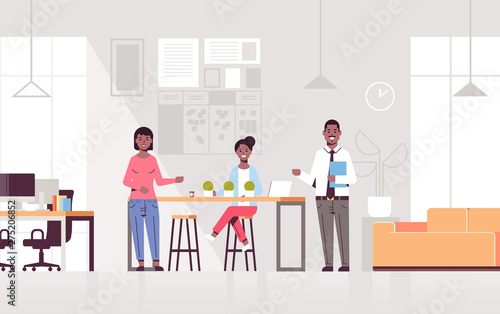 couple coworkers pointing at new female employee introducing hired worker to the team concept modern co-working center office interior flat full length horizontal