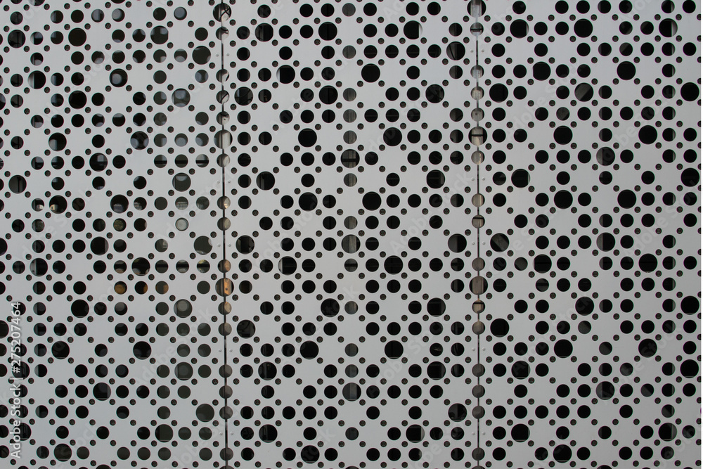 A large number of holes on a sheet of metal