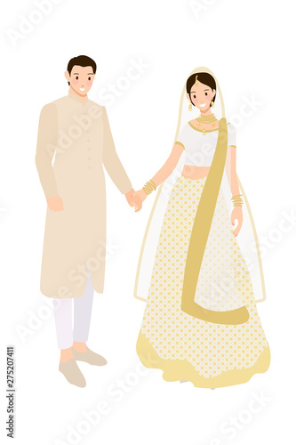 Fototapeta Naklejka Na Ścianę i Meble -  beautiful Indian couple bride and groom in traditional wedding sari dress