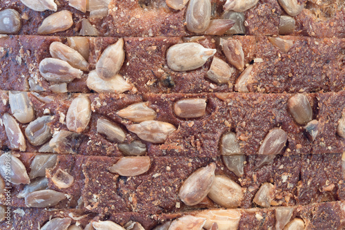 Sliced ​​rye bread with sunflower seeds close-up.