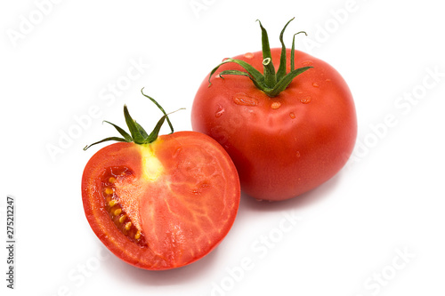 fresh tomato and half a tomato with dew drops isolated on white background	
