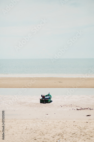 Boat on the sand at Pranburi, Prachuap Khiri Khan, Thailand.