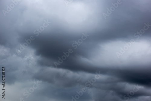 The datk gray storm clouds with thunder on the sky before raining. 