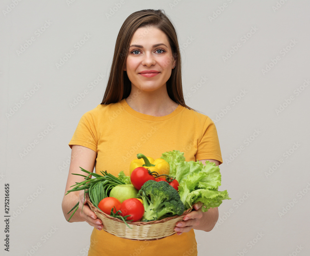 diet concept with smiling woman holding fresh vegetables. diet concept with smiling woman holding fresh vegetables.
