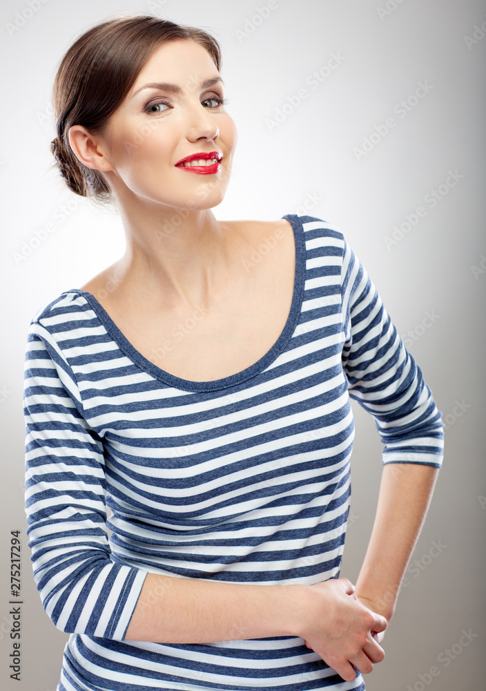 portrait of elegant woman wearing striped slim dress. portrait of elegant woman wearing striped slim dress.