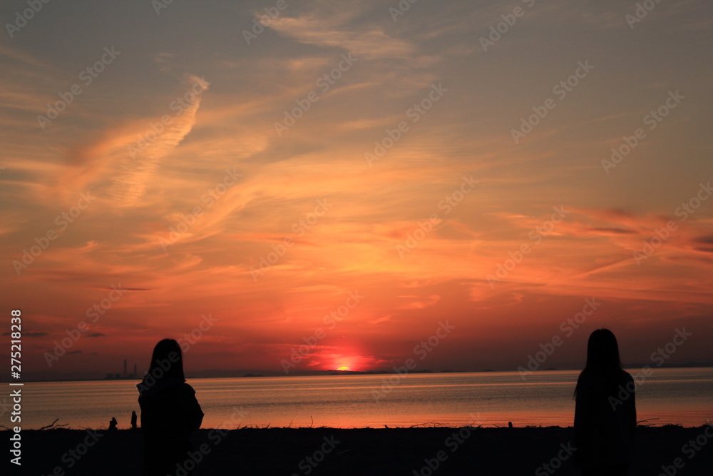 silhouette of man on the beach at sunset