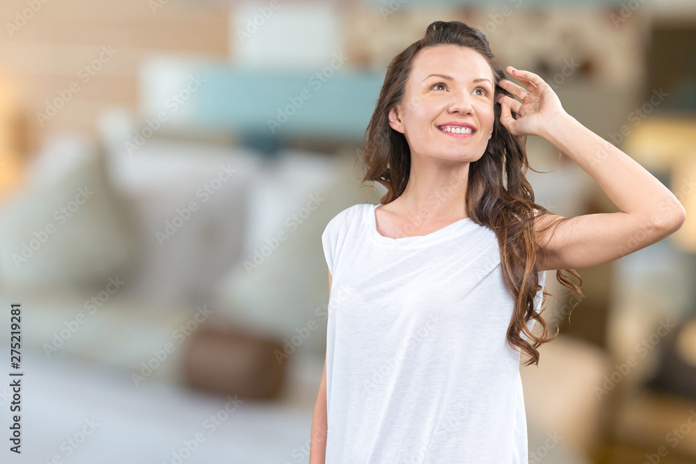 Fototapeta premium Studio shot of happy young beautiful woman smiling