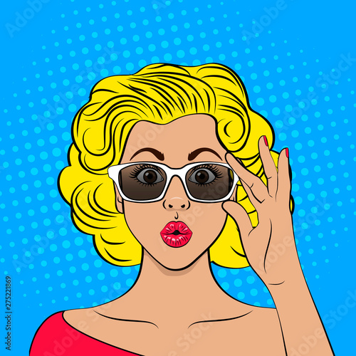 Wow pop art female face. Closeup of sexy surprised blonde woman with wide open eyes and open mouth holding her glasses. Vector colorful background in  retro comic style.