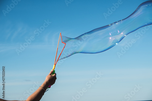 Large  soap bubbles against the blue sky. Lake Ladoga  sunny day.