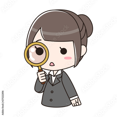 虫眼鏡を覗き込むスーツの女性
