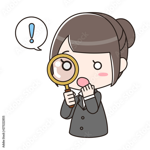 虫眼鏡を覗き込んで驚いているスーツの女性