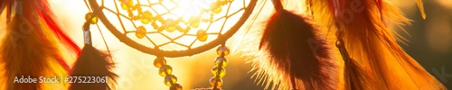 Foto Banner of Handmade dream catcher with feathers threads and beads rope hanging