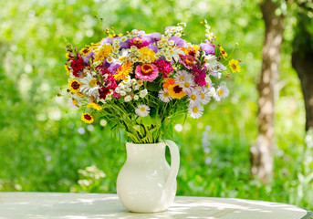 bouquet of summer flowers in a jar