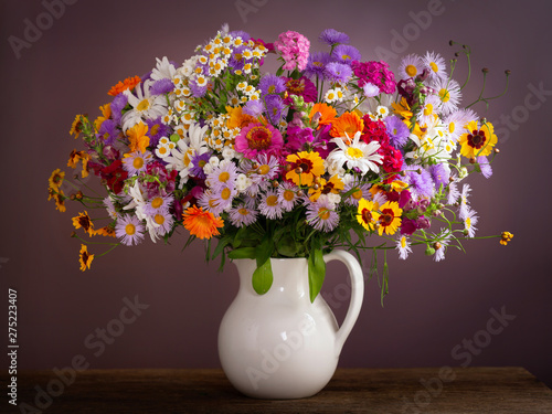 bouquet of summer flowers in a jar