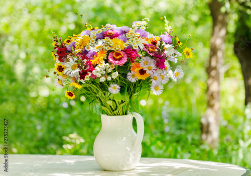 bouquet of summer flowers in a jar