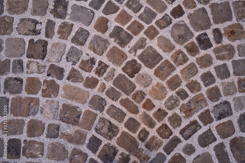 Stone pavement texture. Abstract background of old cobblestone pavement close-up Stone pavement texture. Abstract background of old cobblestone pavement close-up
