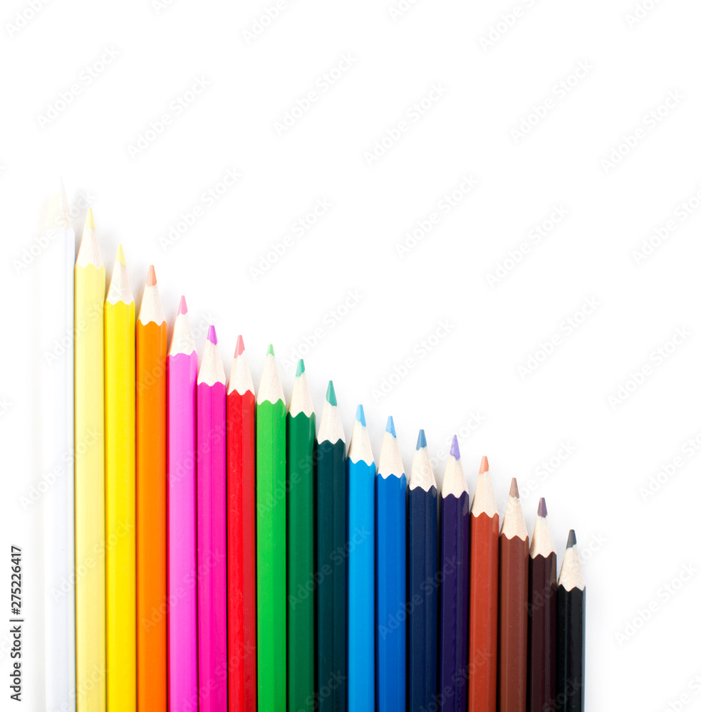 Colored pencils row isolated on white background. Colored pencils row isolated on white background.