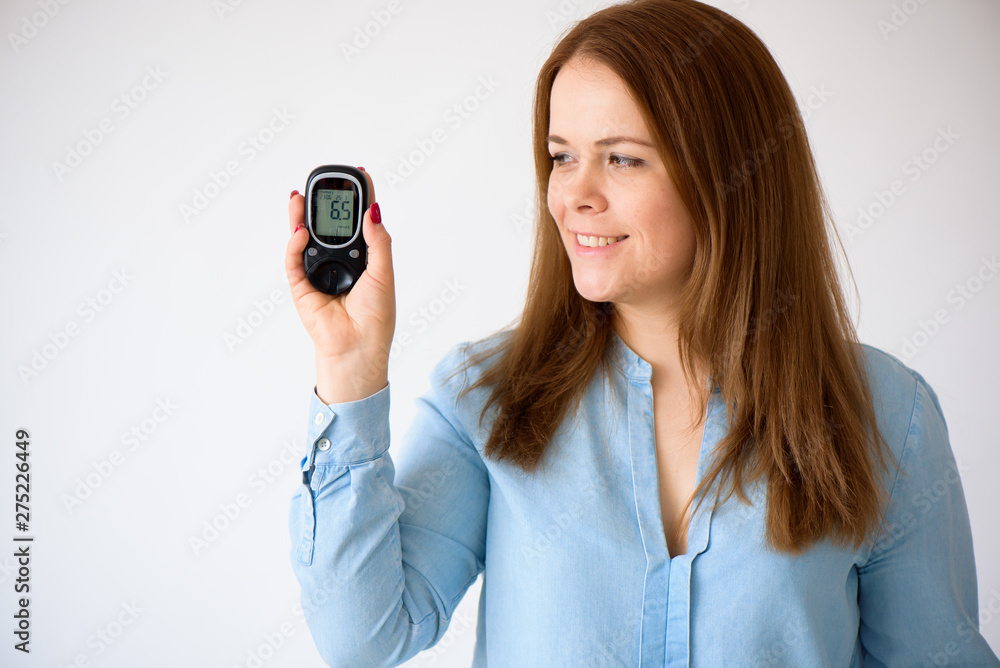 The diabetic measures the level of glucose in the blood. Diabetes concept. Diabetic supplies on a white background The diabetic measures the level of glucose in the blood. Diabetes concept. Diabetic supplies on a white background