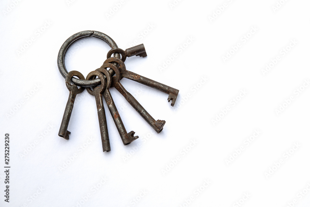 Bunch of different keys on a white background. New housing, property and mortgage loan concept. Copy space Bunch of different keys on a white background. New housing, property and mortgage loan concept. Copy space