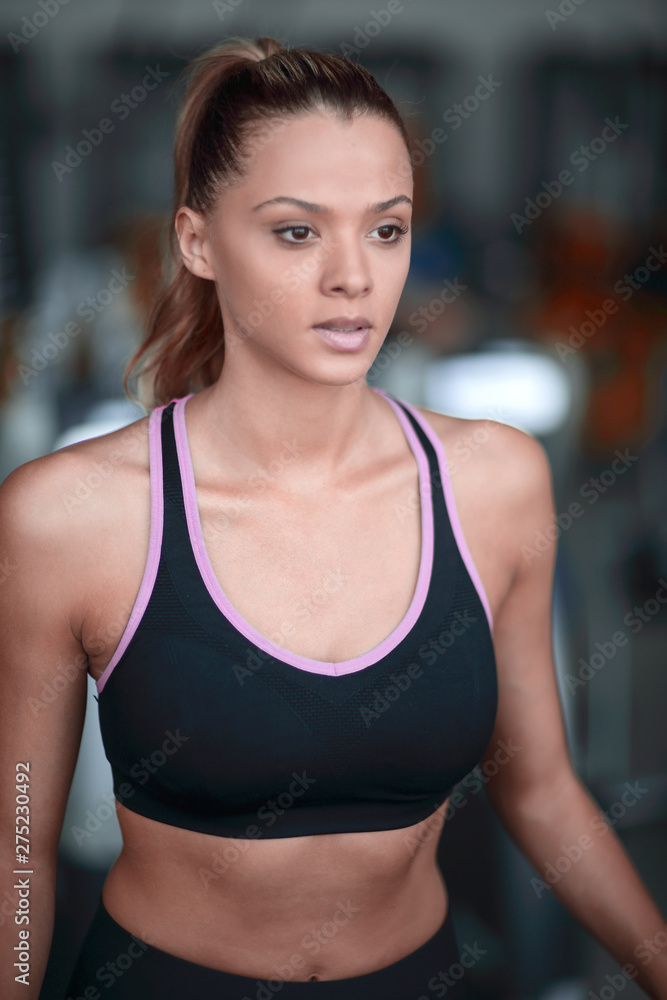 close up.portrait of a confident young woman in the gym.