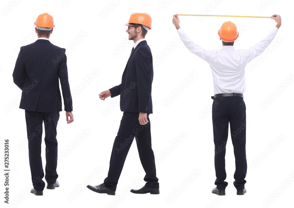 in full growth .a qualified architect in an orange helmet in full growth .a qualified architect in an orange helmet