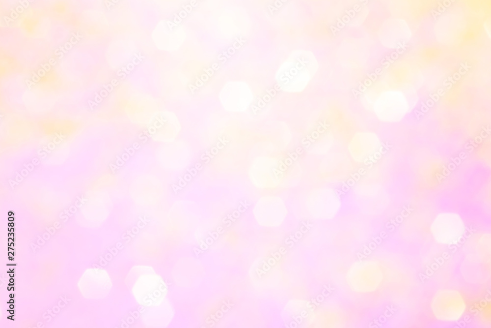 Blurred background - pink surface with gold sparkles. Abstract image. Bright color. Abstract circular bokeh.