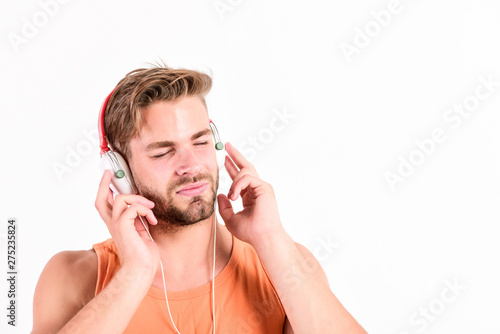 mp3 player. sexy muscular man listen music on phone mp3 player. man with mp3 player on phone isolated on white. unshaven man in headphones. Ebook holds much that is important to me. copy space