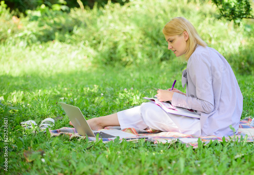Business lady freelance work outdoors. Remote job concept. Stay free with remote job. Managing business remote outdoors. Woman with laptop sit grass meadow. Best jobs to work remotely © be free