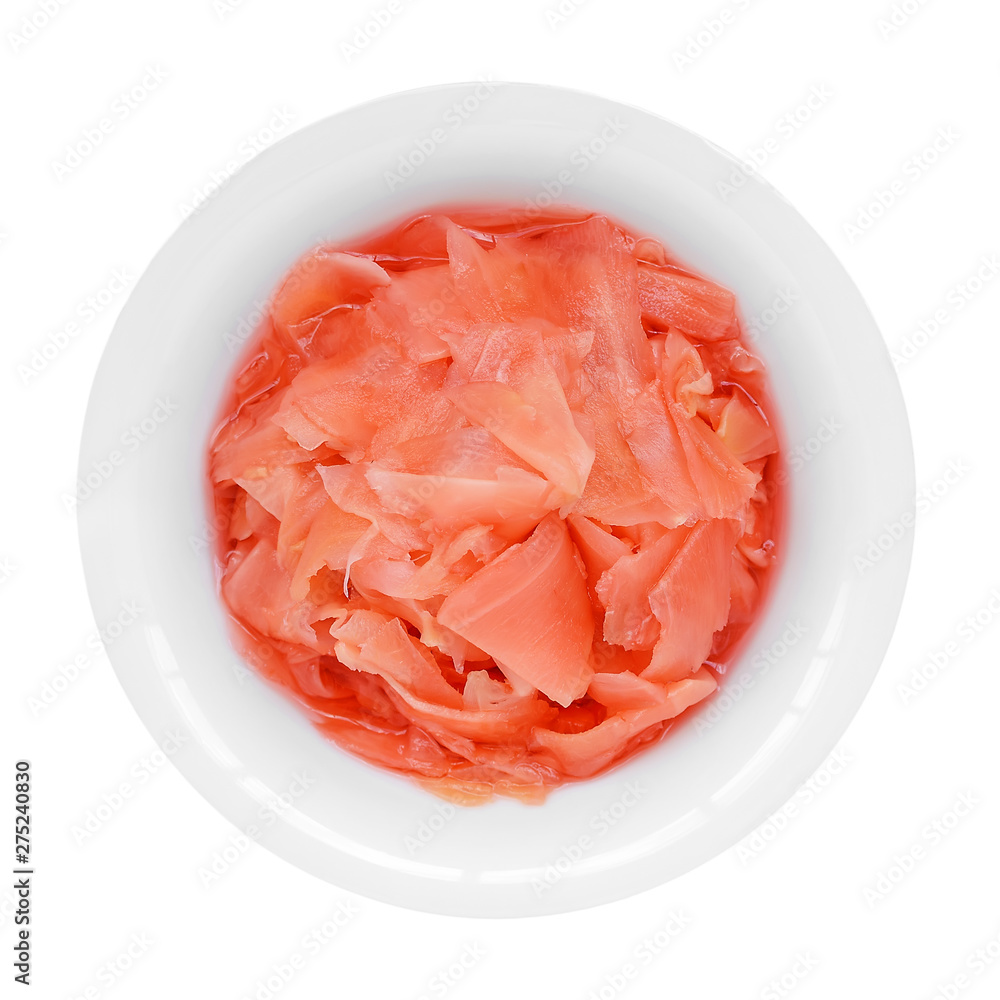 Pink pickled ginger in a white porcelain bowl isolated on a white background. Traditional Japanese condiment for sushi. Healthy eating.