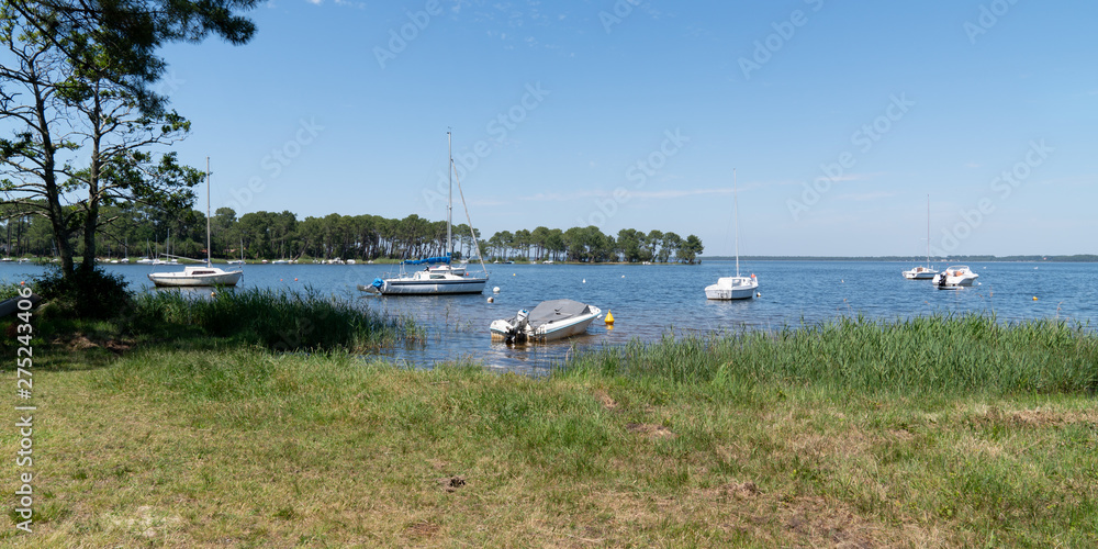 Lake with Boat in Lacanau in France southwest in web banner template Lake with Boat in Lacanau in France southwest in web banner template