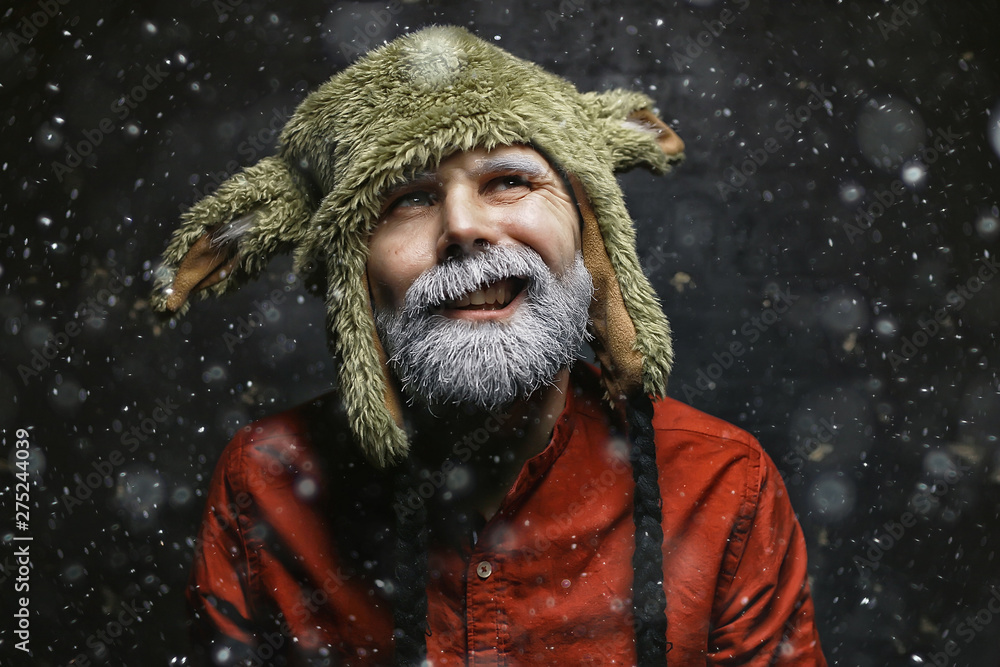 brutal hipster with a gray beard / Christmas winter portrait brutal santa claus, modern trendy guy brutal hipster with a gray beard / Christmas winter portrait brutal santa claus, modern trendy guy