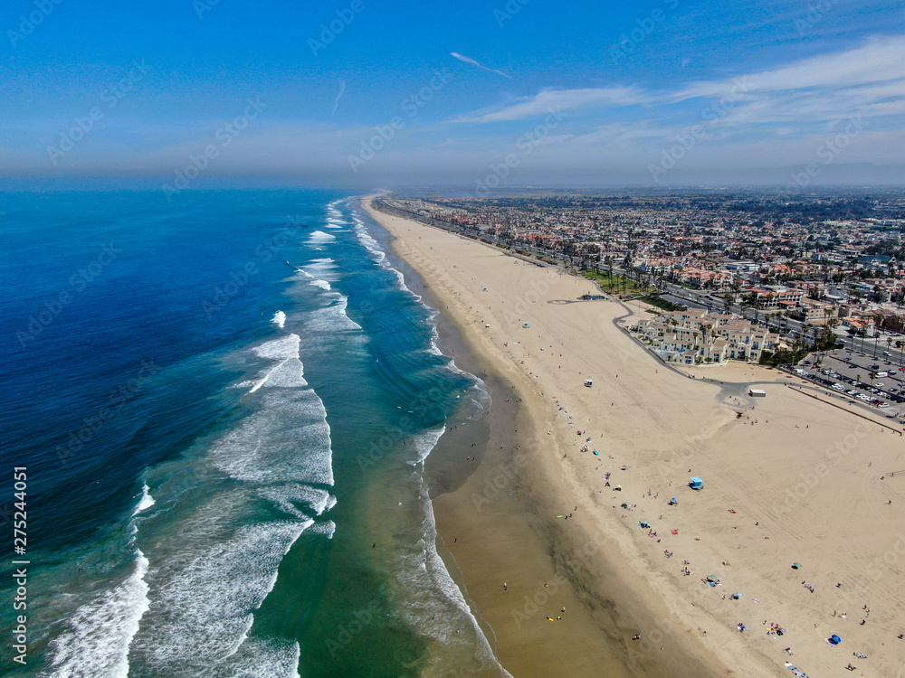 Aerial view of Huntington Beach and coastline during hot blue sunny summer day, Southeast of Los Angeles. California. destination for  holiday and surfer