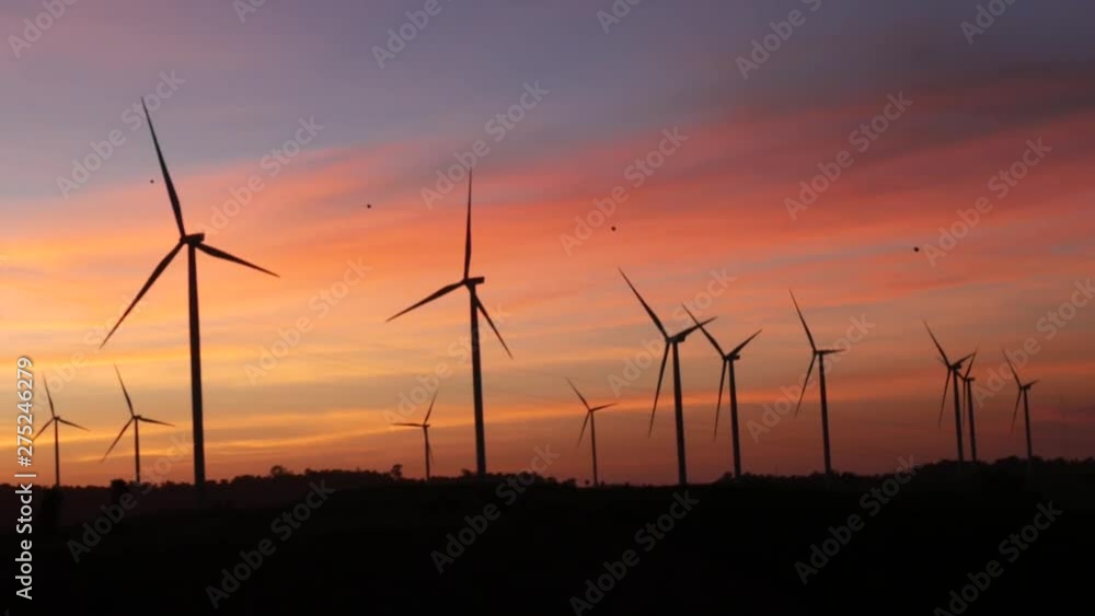 Horizontal Axis Wind Turbine, Wind turbines and power lines against sunset. The clean energy system in Khao Kho District, Phetchabun province, Thailand. Horizontal Axis Wind Turbine, Wind turbines and power lines against sunset. The clean energy system in Khao Kho District, Phetchabun province, Thailand.