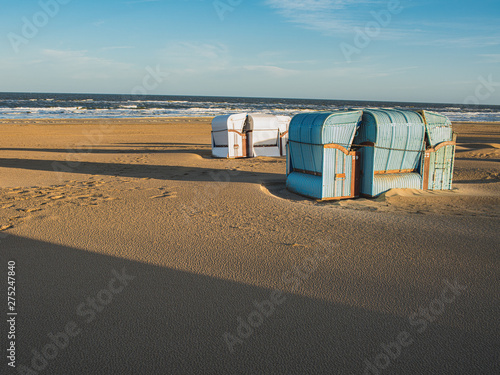 Romantic summer beach with typical  Dutch retro beachchairs in Egmond aan Zee, Netherlands, Europe photo
