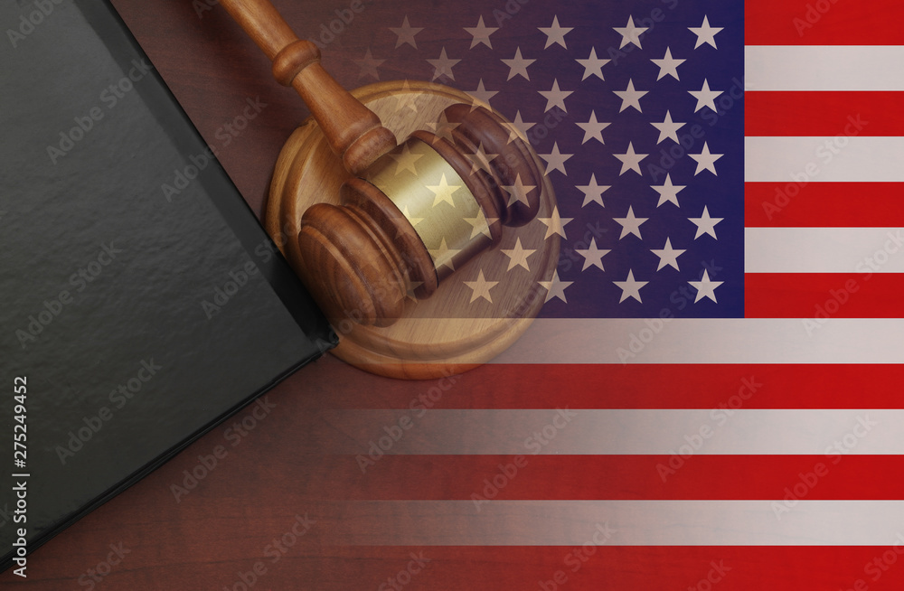 Judge wooden gavel and legal book with usa flag