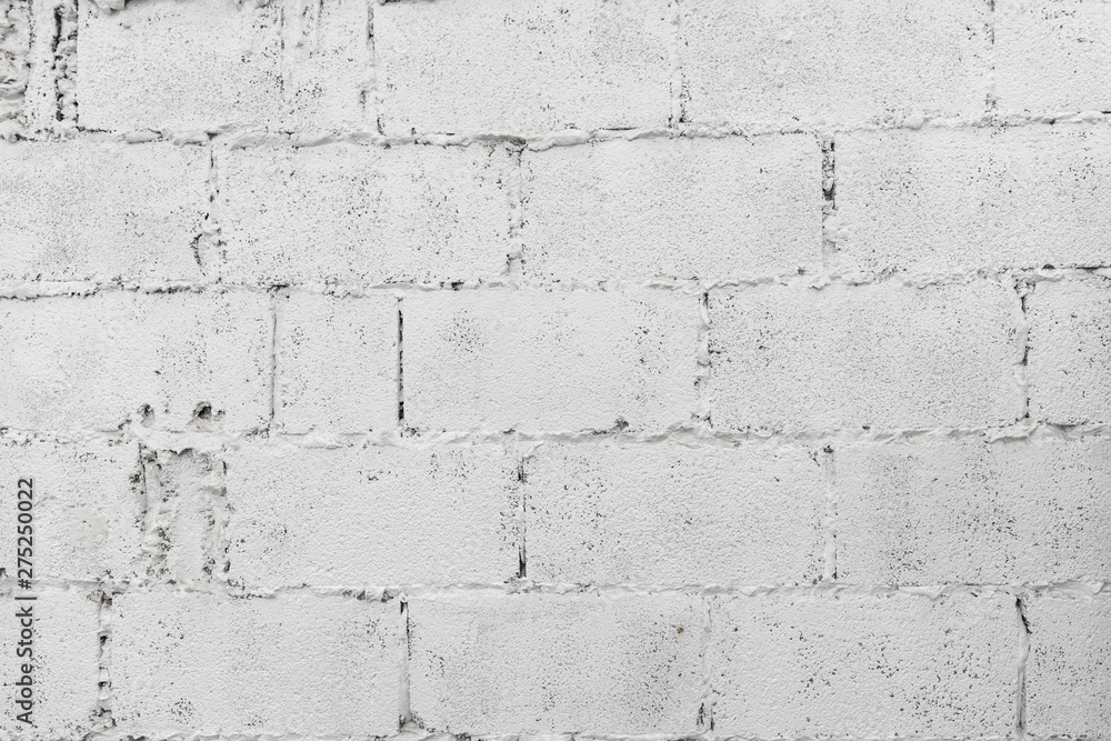 Obraz premium closeup of white decay brick wall abstract background wallpaper or web banner with copy space.