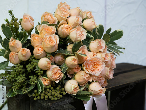 Beautiful wedding bouquet of cream roses. Bush rose for registration of a wedding celebration. © Людмила Селянинова
