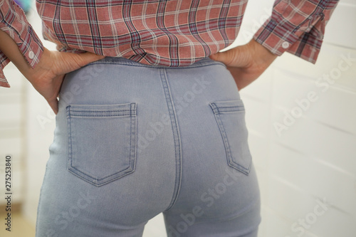 Sexy ass in jeans, sexy clothes ass in pants. Sexy woman wearing of jean  pants from back. Woman wearing of jean pants from back. Female bottom in tight  jeans Stock Photo