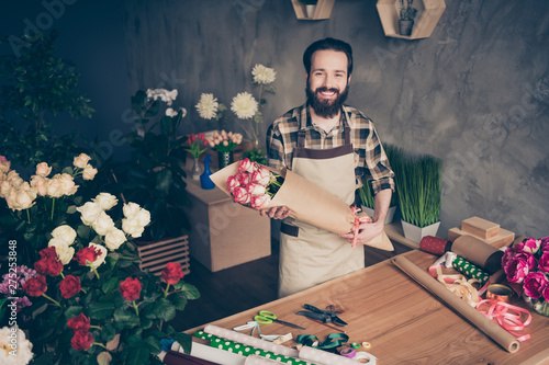 Portrait of cheerful excited relaxed person people handsome self-employed millennial hold hand surprise client feel content satisfied dressed checked shirt clothing occupation