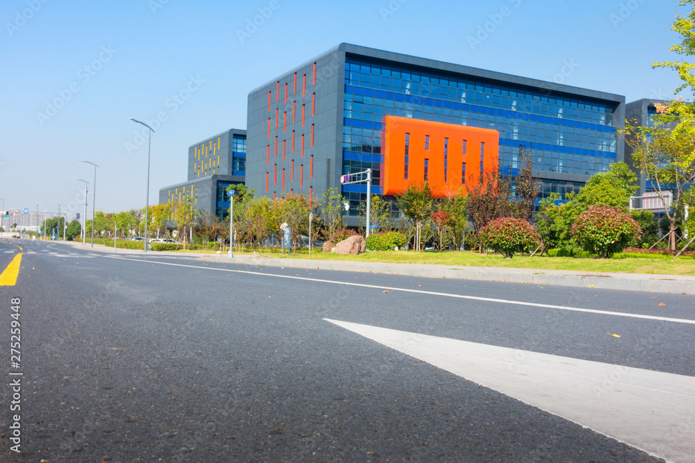 Obraz premium empty brick floor with modern building in background