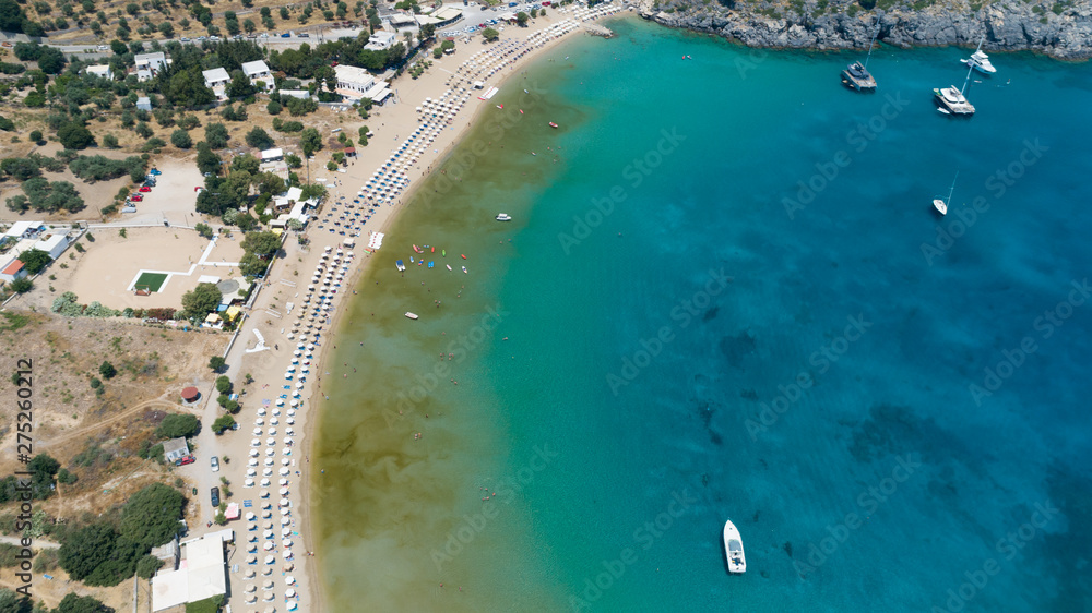 Aerial drone photo of paradise organised with sun beds and umbrellas. Beautiful turquoise water. 