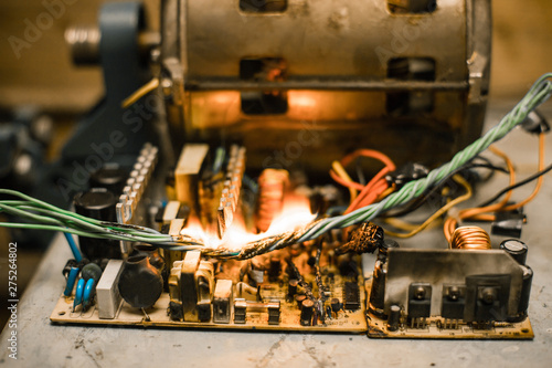 Canvas Print Overloaded electrical circuit causing electrical short and fire