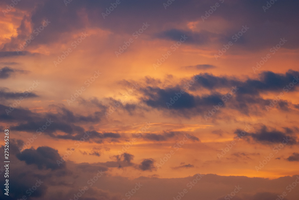 Dramatic sunset. the sun and clouds on an orange sky,