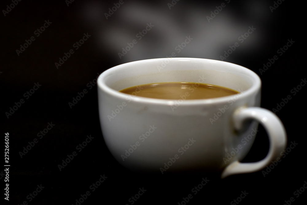 cup of coffee on black background cup of coffee on black background