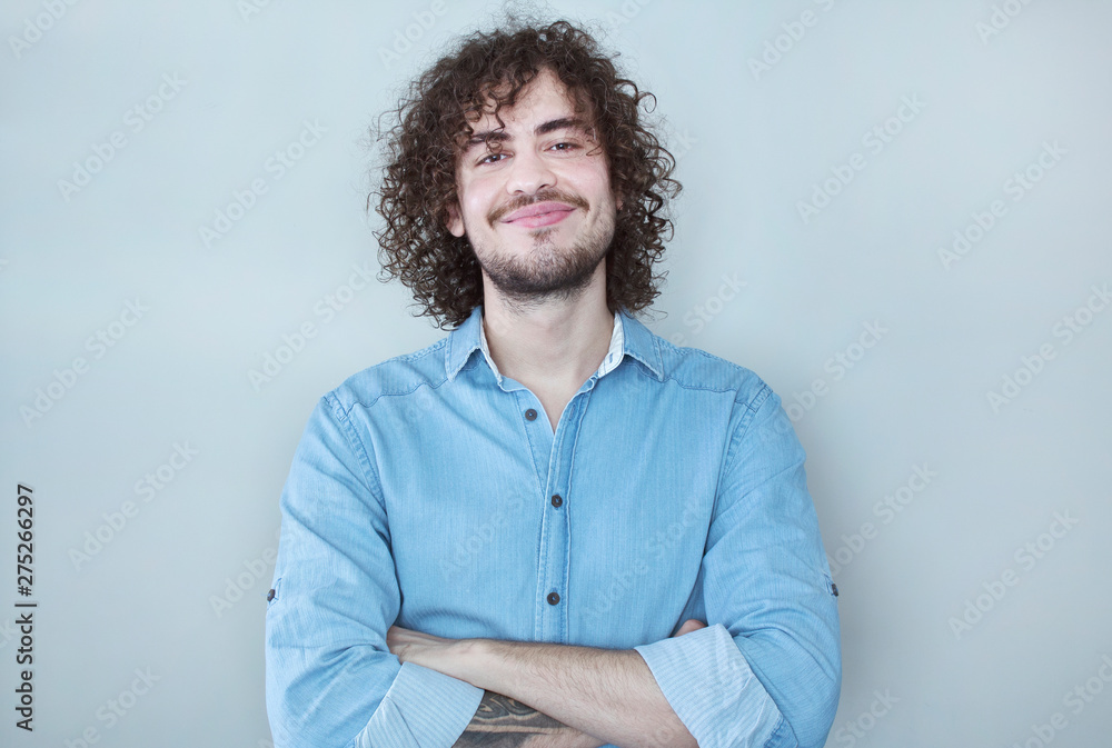 Portrait of an handsome young man smiling.Confidence and business concept. Portrait of an handsome young man smiling.Confidence and business concept.