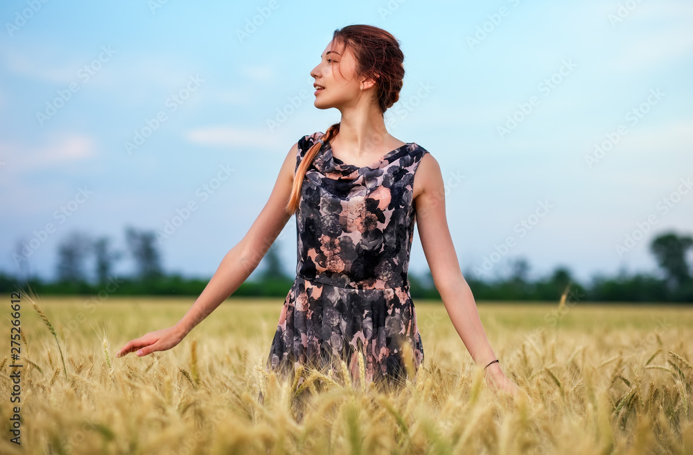 Cute attractive young girl on wheat field during sunset. Pensive look. Romantic atmosphere. Cute attractive young girl on wheat field during sunset. Pensive look. Romantic atmosphere.